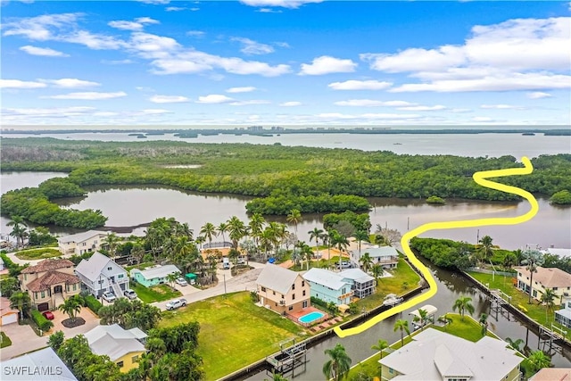 birds eye view of property featuring a water view