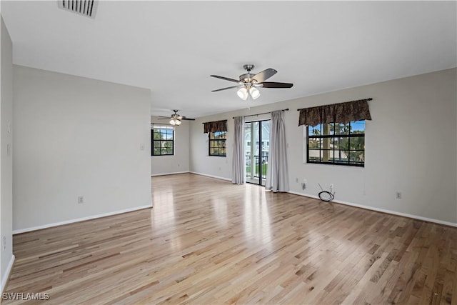 unfurnished room featuring light hardwood / wood-style floors and ceiling fan