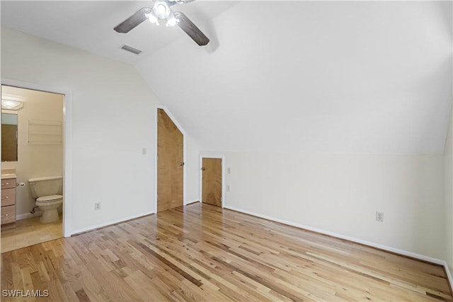 bonus room with vaulted ceiling, light hardwood / wood-style floors, and ceiling fan