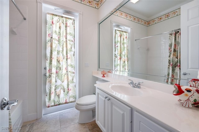 bathroom featuring tile patterned flooring, vanity, and toilet