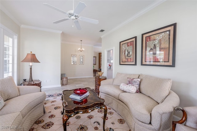 living room with ceiling fan with notable chandelier and crown molding