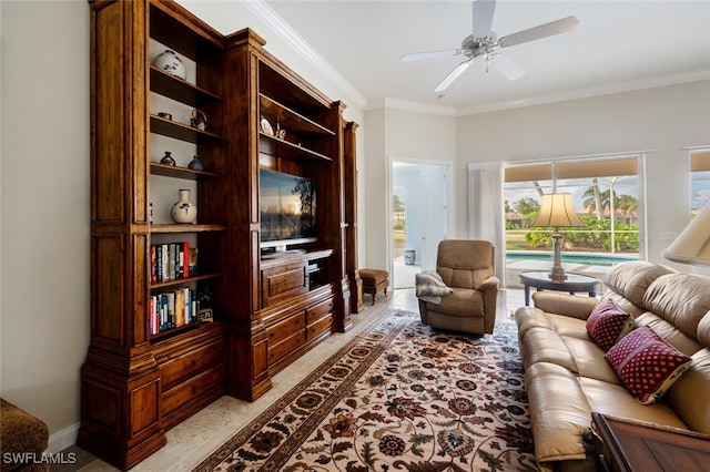 living room featuring ceiling fan and crown molding