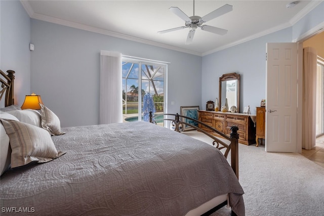 carpeted bedroom with ceiling fan and ornamental molding