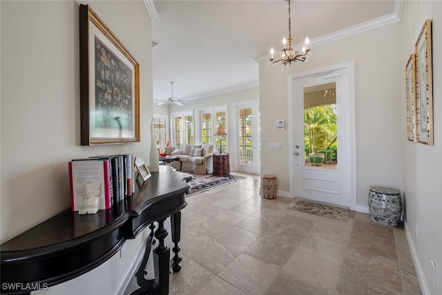 entryway featuring ceiling fan with notable chandelier and crown molding