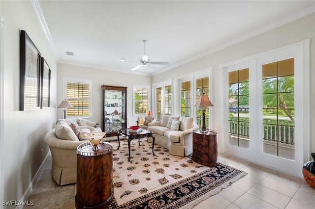 sunroom / solarium featuring ceiling fan