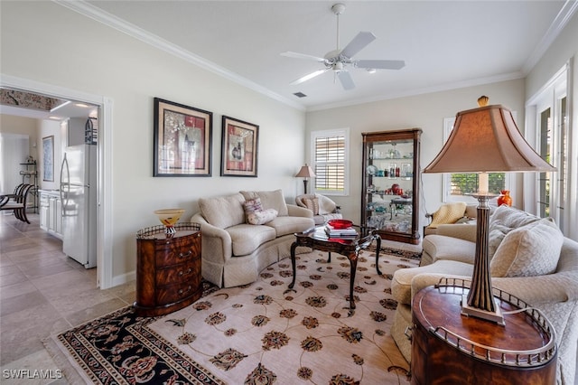 living room featuring ceiling fan and ornamental molding