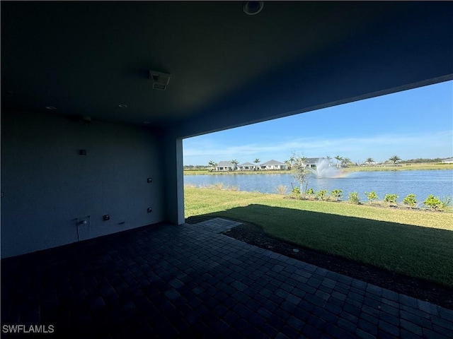 view of patio featuring a water view