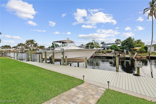 dock area featuring a yard and a water view