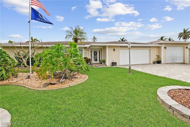 ranch-style home with a garage and a front lawn