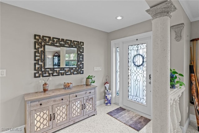 foyer entrance featuring ornate columns