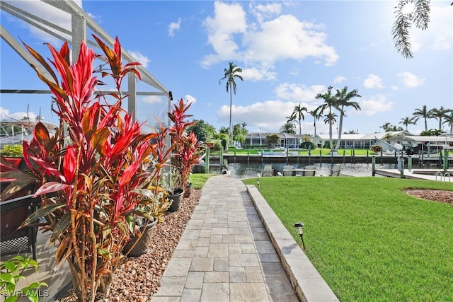 exterior space with a lawn and a water view