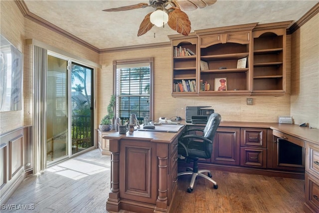 office area with dark hardwood / wood-style floors, ceiling fan, and crown molding