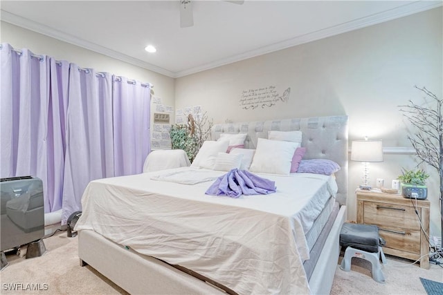 bedroom featuring ceiling fan, crown molding, and light colored carpet