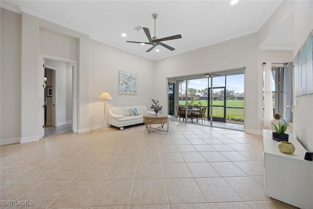 sitting room featuring light tile patterned floors, ceiling fan, and crown molding