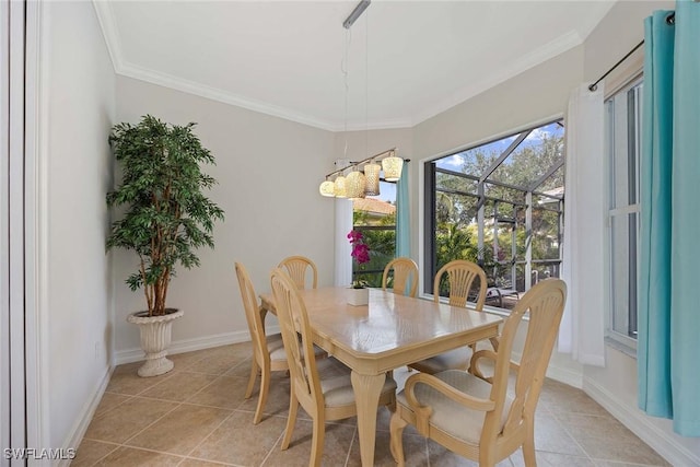 dining room with crown molding, light tile patterned floors, and a chandelier