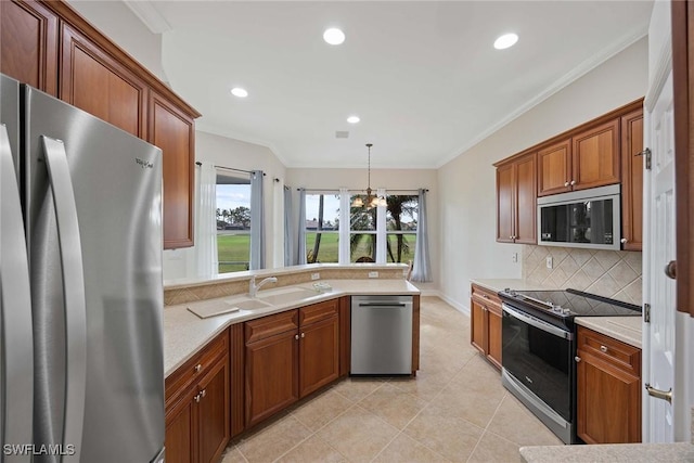 kitchen with decorative backsplash, stainless steel appliances, a chandelier, hanging light fixtures, and light tile patterned flooring