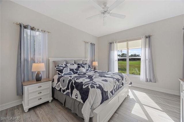 bedroom featuring light hardwood / wood-style floors and ceiling fan