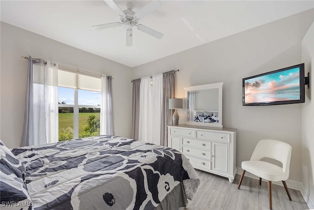 bedroom featuring ceiling fan and light hardwood / wood-style flooring