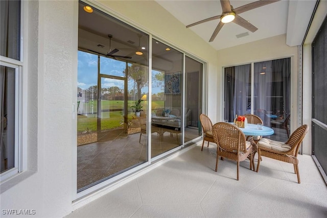 sunroom / solarium with ceiling fan