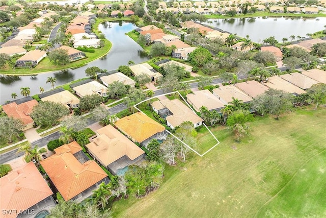 bird's eye view with a water view