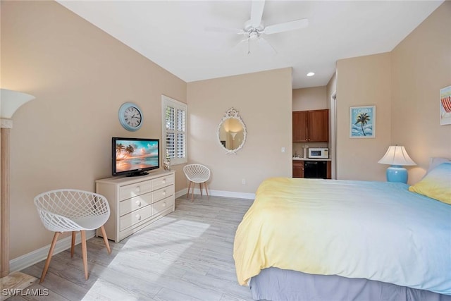 bedroom with light hardwood / wood-style flooring and ceiling fan