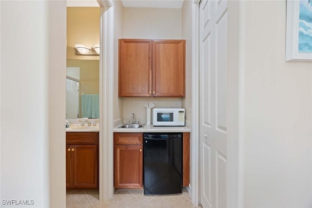 bar with dishwasher, light tile patterned floors, and sink