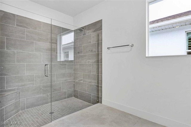 bathroom featuring tile patterned floors and walk in shower