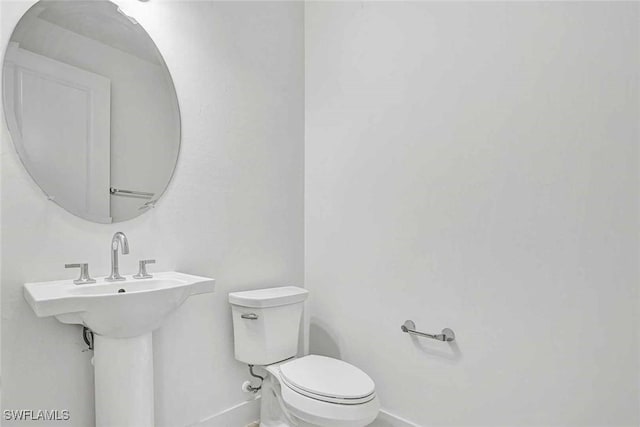 44402 Panther Dr, Punta Gorda, FL 33982 - half bath featuring baseboards and toilet