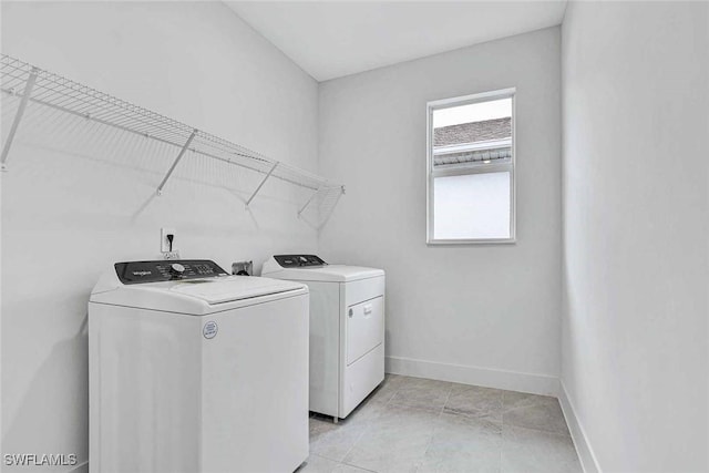 laundry room with washing machine and dryer