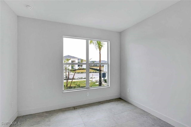 empty room with light tile patterned floors