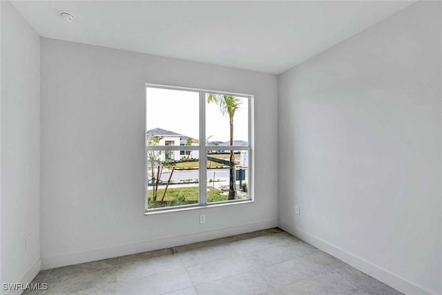 44402 Panther Dr, Punta Gorda, FL 33982 - empty room with a smoke detector and light tile patterned floors