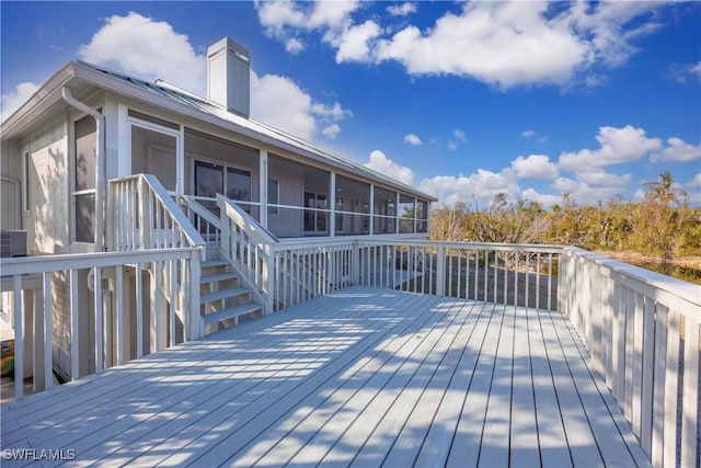 wooden deck featuring a sunroom