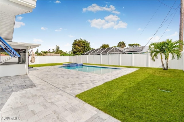 view of pool with a lawn, a patio area, and an in ground hot tub