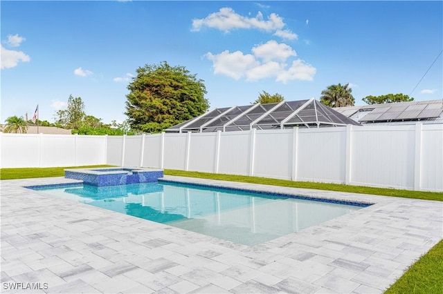 view of pool featuring an in ground hot tub and a patio area