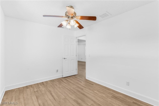 empty room featuring light hardwood / wood-style flooring and ceiling fan