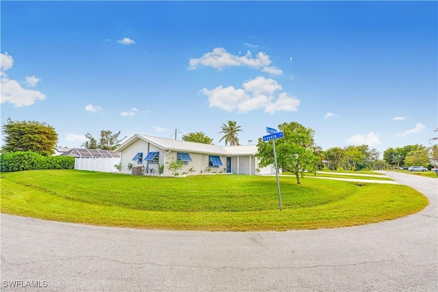 ranch-style home with a front lawn