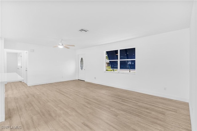 unfurnished room with ceiling fan and light hardwood / wood-style floors