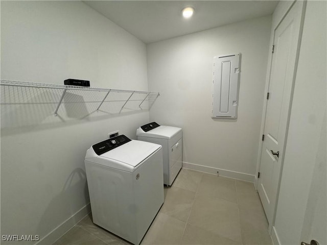 washroom with electric panel, light tile patterned flooring, and independent washer and dryer