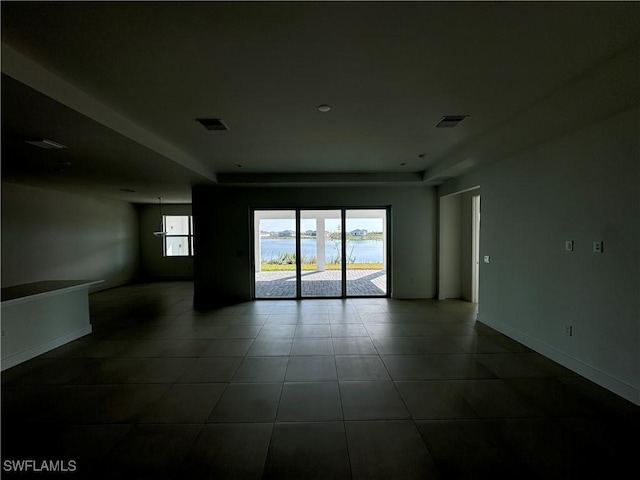 empty room featuring a water view