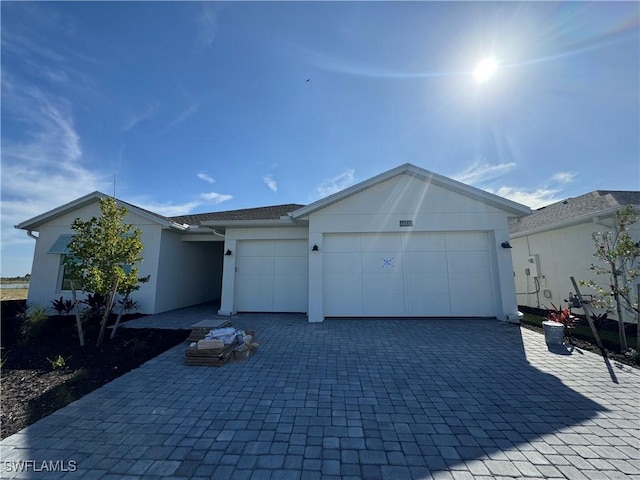 single story home with a garage