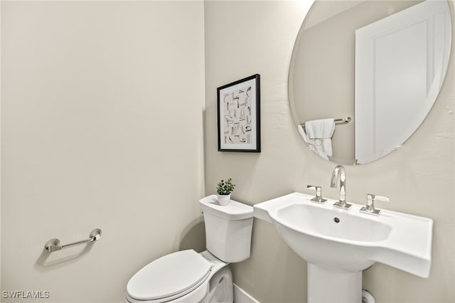 bathroom featuring a sink and toilet