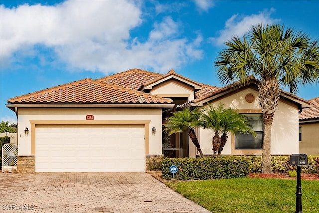 mediterranean / spanish house featuring a garage