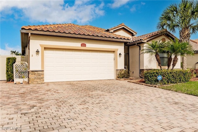 mediterranean / spanish-style home featuring a garage