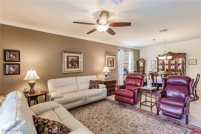 living room featuring crown molding, light tile patterned flooring, and ceiling fan with notable chandelier