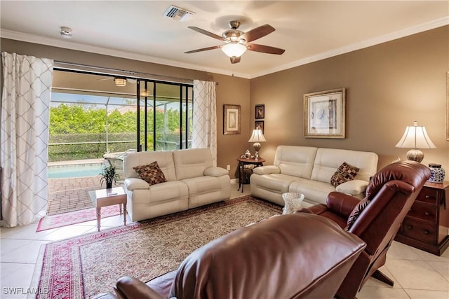 living room featuring ceiling fan, light tile patterned floors, and ornamental molding