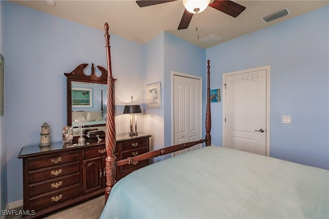 carpeted bedroom featuring ceiling fan and a closet