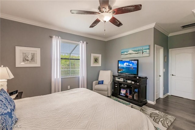 bedroom with hardwood / wood-style floors, ceiling fan, and crown molding