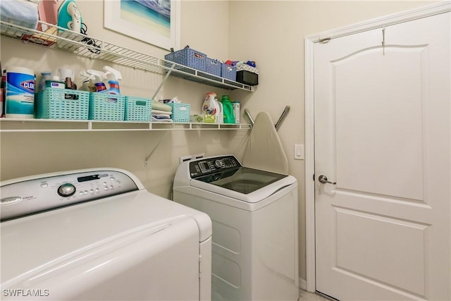 laundry room featuring washing machine and dryer