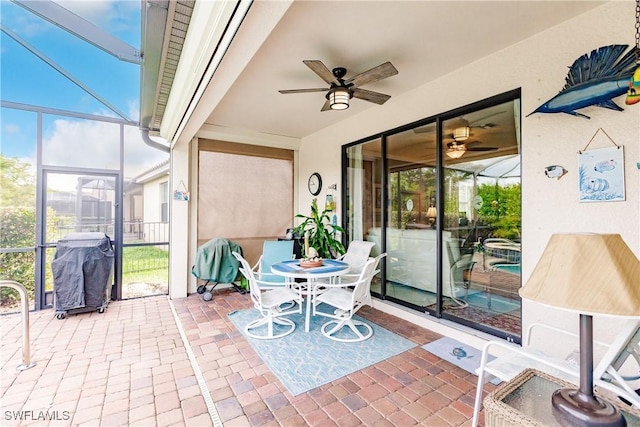 view of patio / terrace featuring ceiling fan, a grill, and a lanai