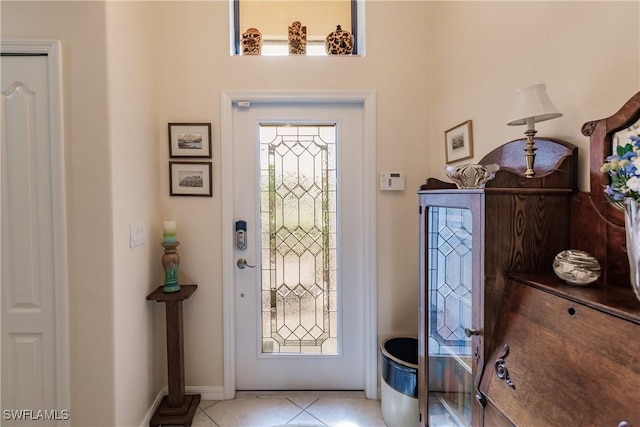 entryway with light tile patterned floors